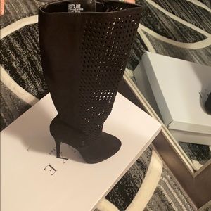 Black knee high boots.